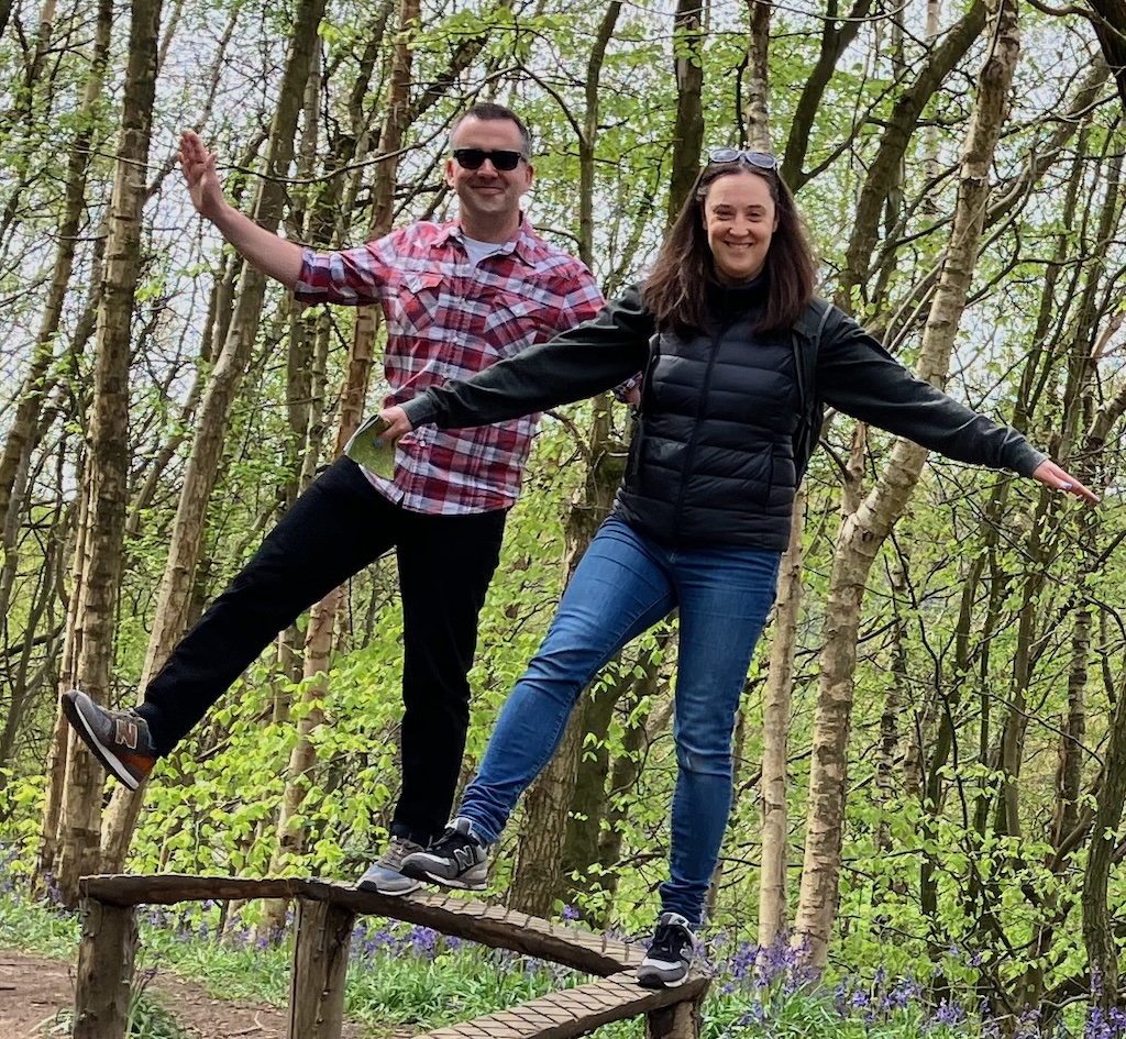 Chris and Sian balanced on a wooden beam